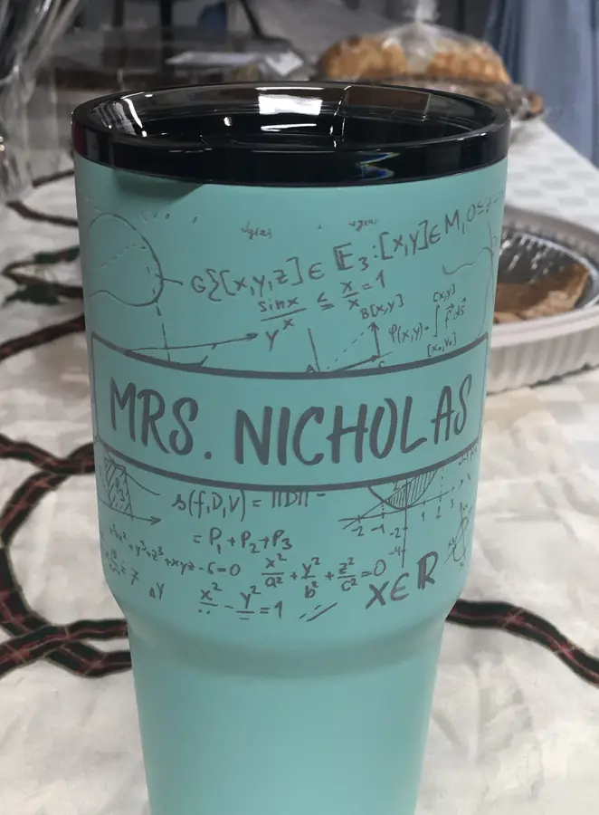 Seafoam tumbler engraved all the way around with math equations and Mrs. Nicholas